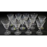 A set of twelve Waterford crystal Tramore pattern claret glasses, each 12.5cm high, some bearing