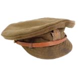 A WWI Canadian army peak cap, dated 1916, with leather adjusting belt and Canada cap badge, 22cm