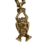 A 9ct gold Tasmanian devil pendant and chain, the taz bearing maker BBD, Sheffield 1958, 7.5cm high,