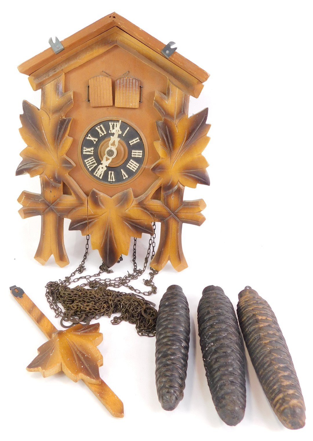 A 20thC pine cased cuckoo clock, with applied maple leaf vines, Regula movement, weights and