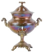 A 19thC copper and brass samovar, with floral finial and two scroll cast handles, with two scroll