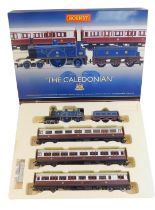 A Hornby The Caledonian OO gauge set, comprising Caledonian Railway 4-2-2 123 locomotive,