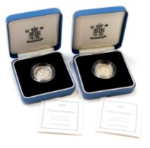 Two Royal Mint silver proof one pound coins, for 2002, in presentation boxes with certificate of