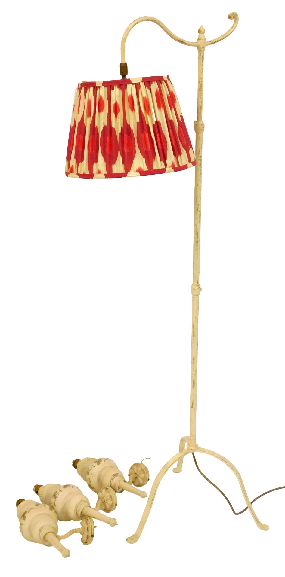 A 20thC painted brass standard lamp, the pink and cream pleated shade, 132cm high, together with a