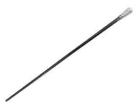 A white metal topped walking cane, the domed floral top on an ebonised cane, unmarked, possibly