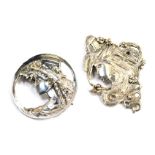 Two Art Nouveau brooches, each depicting figures of females with flowing flowers, one 6cm x 4cm,