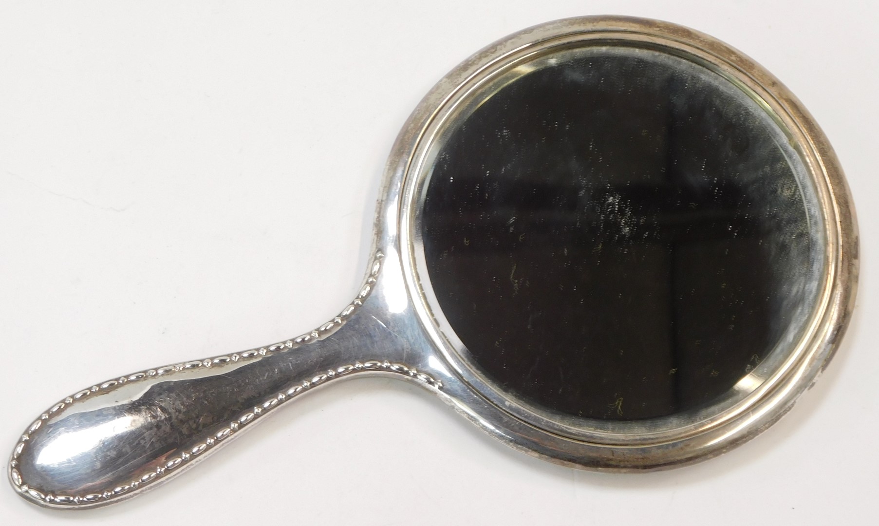 A George V white metal backed hand mirror, circular mirror plate, on engine turned and based case - Image 2 of 3