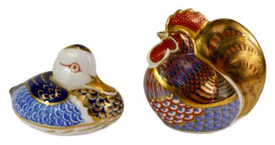 Two Royal Crown Derby porcelain paperweights, modelled as hen, 10cm high, and duck, 8cm high, red