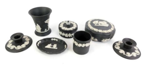 A collection of Wedgwood black Jasperware, comprising two squat candle stands, trinket dish,