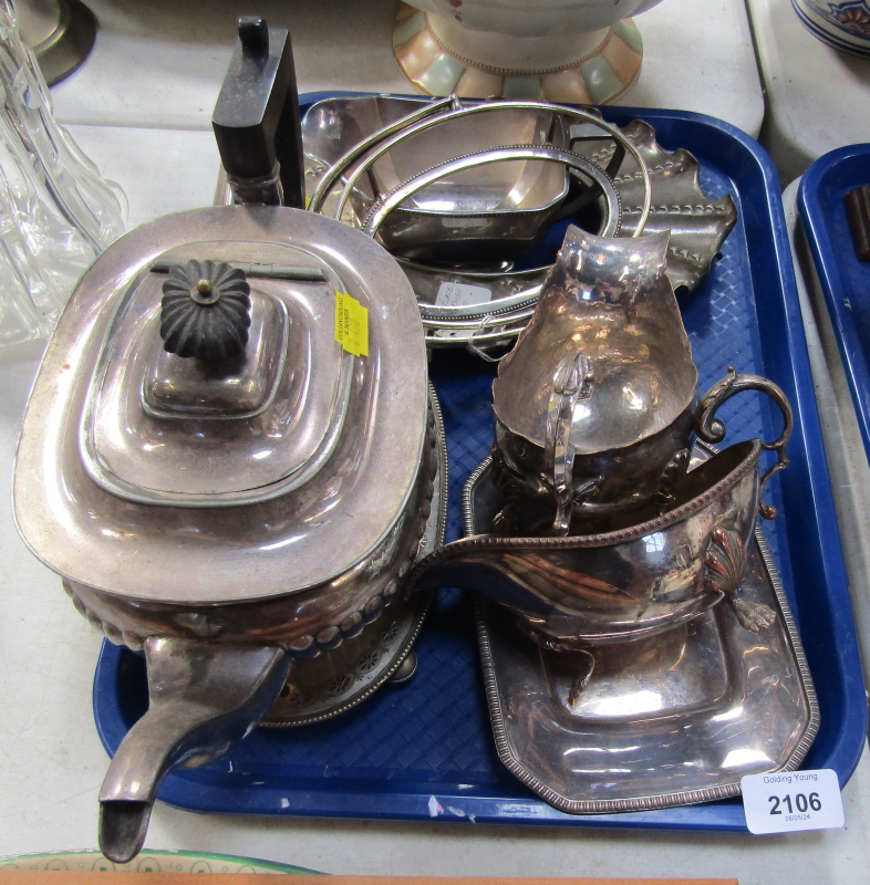 A silver plated semi fluted teapot and three silver plated sauce boats and other assorted silver