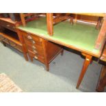 A 1950s/1960s mahogany and leatherette inset office desk, above an arrangement of five drawers