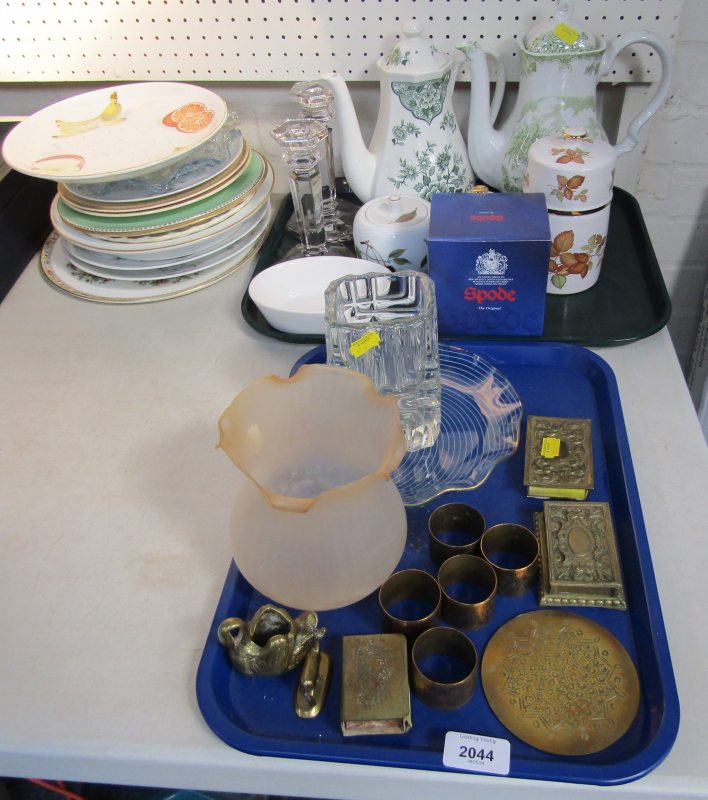 A brass match case, brass napkin rings, glass cake plate, two teapots, Evesham ware mustard, cabinet