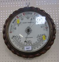 A Richard Parker of Hereford early 20thC oak cased barometer.