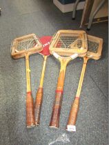 Four Dunlop badminton racquets.