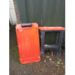 A car inspection trolley and plastic trestle stand.