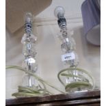 A pair of crystal style table lamps.