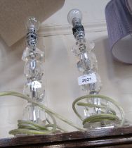 A pair of crystal style table lamps.