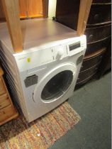 A John Lewis washer dryer, 600 spin, 8kg.