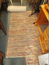 Two mottled multicoloured rectangular rugs.