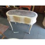 A kidney shaped painted dressing table, with faux leather inset to top.