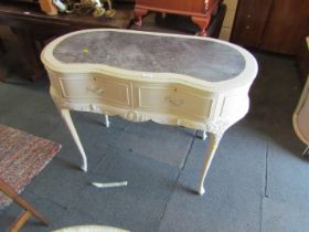 A kidney shaped painted dressing table, with faux leather inset to top.