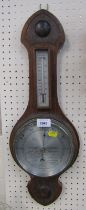 A 20thC oak cased barometer, with silvered dial. (AF)