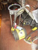 A Karcher pressure washer and accessories, to include patio cleaner, etc.