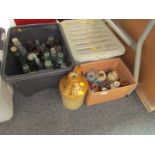 A group of stoneware and glass bottles, comprising Adcocks of Peterborough stoneware bottle, and