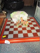 A chess board, with collection of modern warrior figures.
