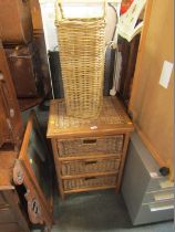 A wicker three drawer pine cabinet and a cane umbrella stand. (2)