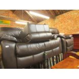 A black sofa suite, comprising a two seater reclining sofa, an armchair, and a footstool. (3)