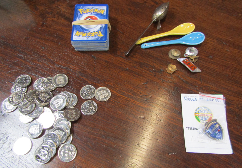 Various football collectors coins, small group of Pokemon cards, and a sifter spoon. (1 bag)