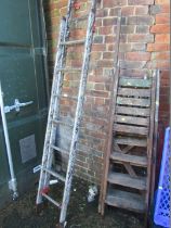 Two aluminium step ladders and two wooden step ladders.