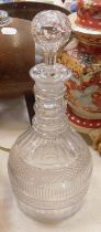 A Regency triple ring neck cut glass mallet shaped decanter, with slice cut shoulders and hobnail