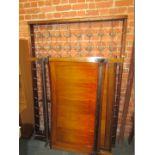 An Edwardian mahogany double bed frame, with boxwood inlay and marquetry spun front, on a sprung