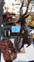 Carved wooden wares, comprising child like figure, water buffalo, spoons, wall mask, antelope,