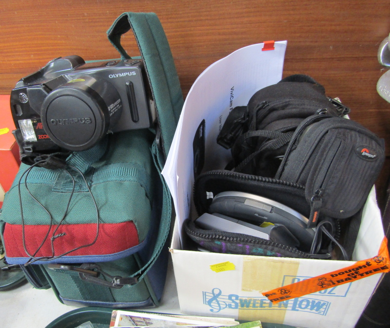 A small group of camera equipment, to include Panasonic Walkman, Sony Sound Clip, Vivicam digital
