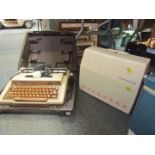 A Smiths Corona cased typewriter, and a Frister and Rossman cased sewing machine. (2)