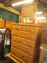 A pine chest of two short and four long drawers, pine dressing table with three drawers, and a