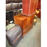 A suitcase, reproduction television cabinet, and a mahogany finish two door cupboard. (3)