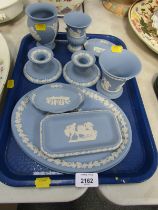 Wedgwood blue Jasperwares, comprising vases, squat candlesticks, oval plate, pin dish, etc. (1