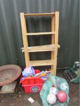 A pine storage rack, clothes rail, various shovels, buckets, footballs, etc. (a quantity)