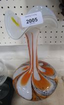 An Art Glass vase, on orange and black swirled rim, with flared top, 34cm high.