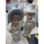 A pair of late 19thC Continental fairing figures, 23cm high.