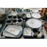 A Denby stoneware part service, comprising tureens and covers, dinner plates, vinaigrette, salt