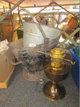 Two galvanized buckets and a brass oil lamp base.
