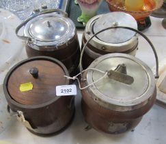 Three oak biscuit barrels, and an oak cauldron shaped biscuit barrel with plated mounts and feet. (