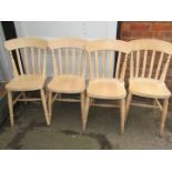A set of four pine kitchen chairs.