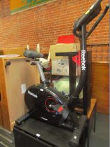 A Reebok exercise bike, with instruction manual.