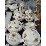 A Sheraton pattern pheasant part tea and dinner service, comprising three tureens and covers,